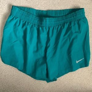Nike teal dri-fit running shorts